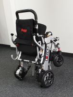 Vorschau: Elektro-Reise-Rollstuhl R-GO (6 km/h) silber, neuwertig Vorschau: Elektro-Reise-Rollstuhl R-GO (6 km/h) silber, neuwertig