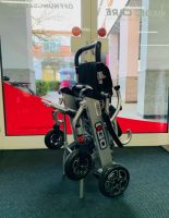 Vorschau: Pride I-Go (6 km/h) silber, Vorführ - Reise-Elektrorollstuhl Vorschau: Pride I-Go (6 km/h) silber, Vorführ - Reise-Elektrorollstuhl