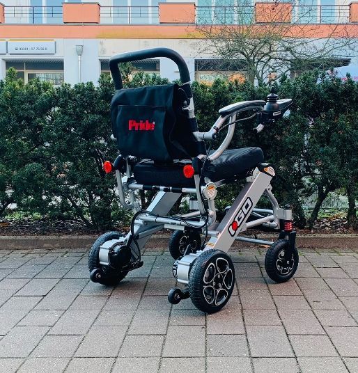 Pride I-Go (6 km/h) silber, Vorführ - Reise-Elektrorollstuhl