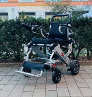 Vorschau: Pride I-GO (6 km/h) silber - Gebrauchter Reise-Elektrorollstuhl seitlich Vorschau: Pride I-GO (6 km/h) silber - Gebrauchter Reise-Elektrorollstuhl seitlich