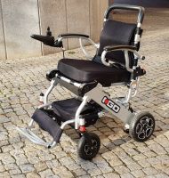 Elektro-Reise-Rollstuhl R-GO (6 km/h) silber - Neuwertiger Elektrorollstuhl