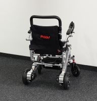 Vorschau: Elektro-Reise-Rollstuhl R-GO (6 km/h) silber, neuwertig Vorschau: Elektro-Reise-Rollstuhl R-GO (6 km/h) silber, neuwertig